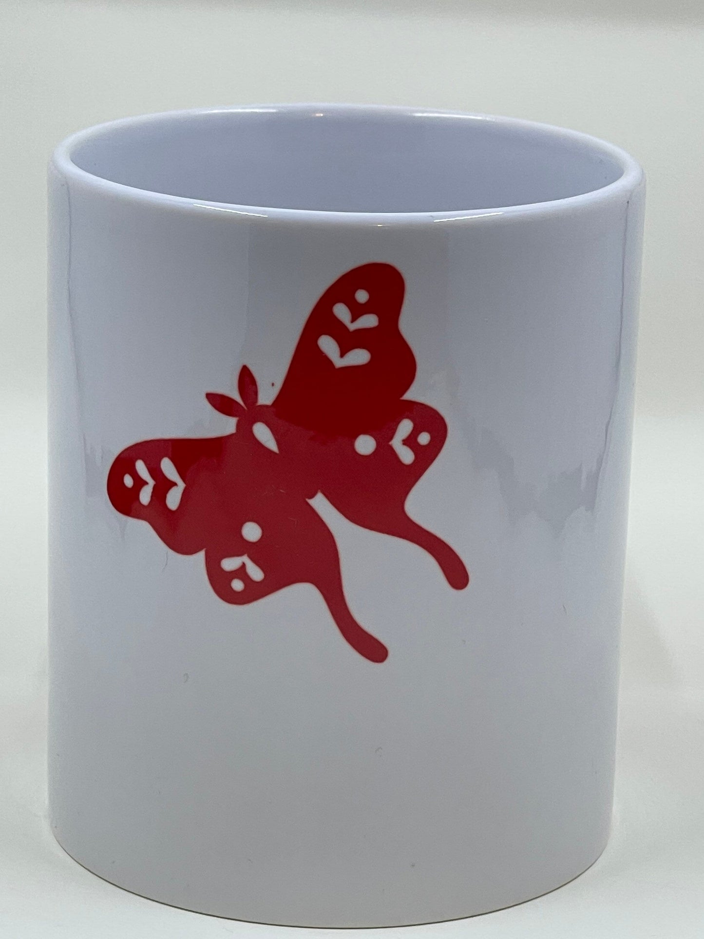 Heart and moth coffee mug