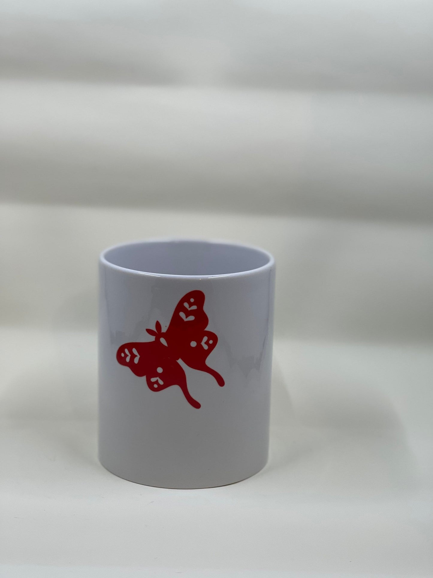 Heart and moth coffee mug